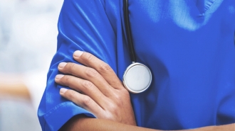 Medical professional's crossed arms