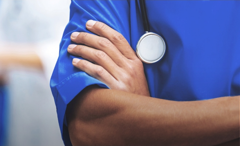 Medical professional's crossed arms
