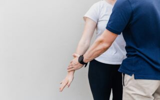 manager-touching-employee-scaled-aspect-ratio-320-200